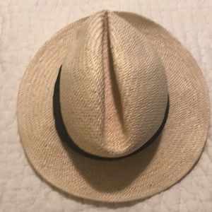 Straw hat with black ribbon.